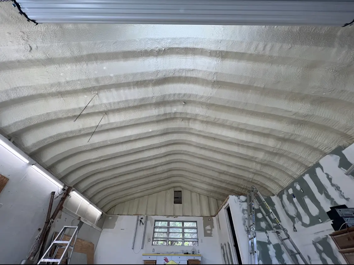 Spray polyurethane foam applied to the underside of a metal roof deck in Westlake